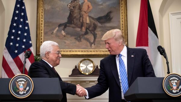 US President Donald Trump and Palestinian President Mahmoud Abbas shake hands at the White House, in Washington DC, May 3 2017. (AFP/Nicholas Kamm) 