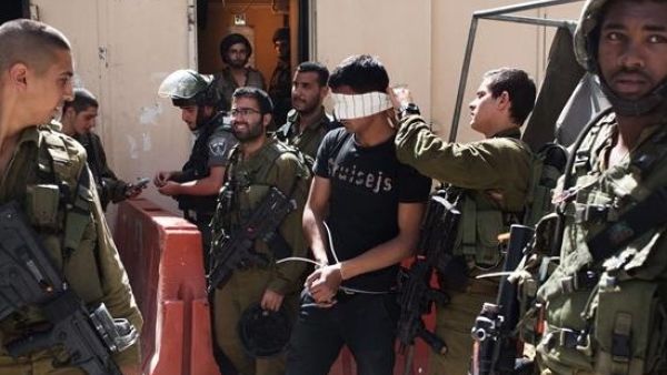 Palestinian man arrested by Israeli soldiers in the occupied West Bank city Hebron. (AFP/File)