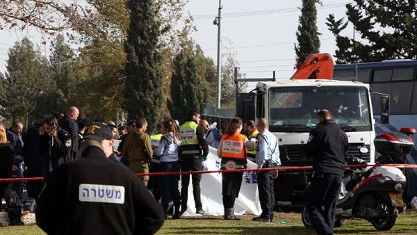 Israeli security forces and medics gather at the site of a ramming attack in Jerusalem. (AFP/File)