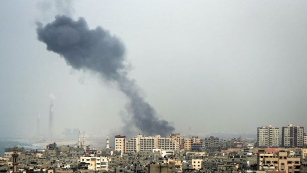 A smoke plume rises in Gaza City after a reported Israeli airstrike on March 18, 2017. (AFP/Mahmud Hams)