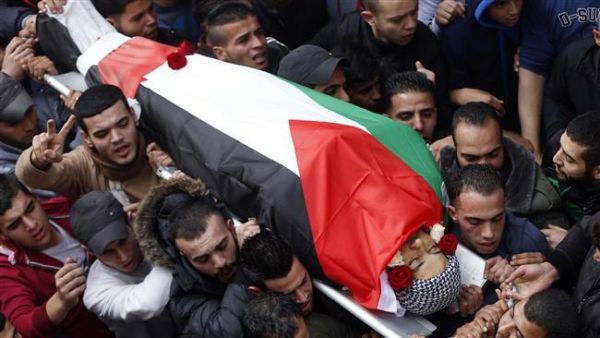 Mourners carry the body of a Palestinian citizen at a funeral in Palestine. (AFP)