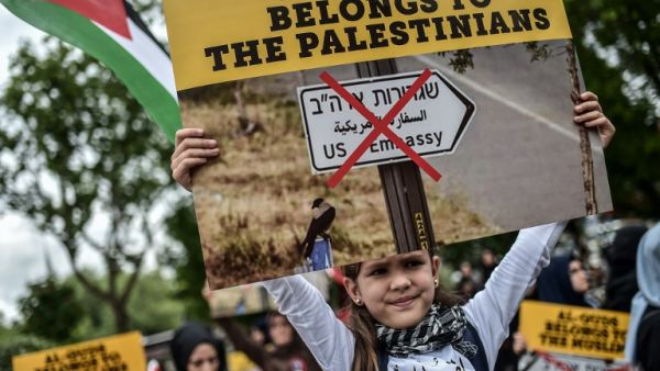 A young girl holds placard reading "Al Quds belongs to Muslims" on May 11, 2018 in Istanbul, during a demonstration against US President Donald Trump’s controversial decision to recognise Jerusalem as Israel’s capital by opening a US embassy there. (AFP/ File Photo)