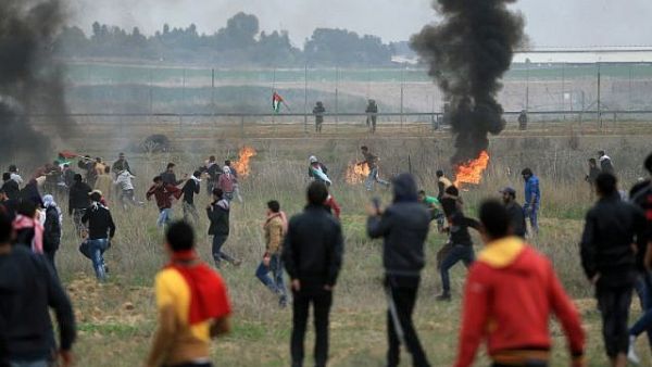 Palestinian protesters clash with Israeli soldiers near the border fence east of Gaza City. (AFP/File)