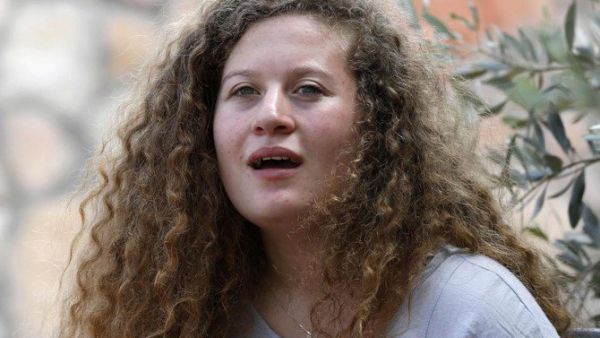 Palestinian activist and campaigner Ahed Tamimi, 17, listens during an interview with Agence France-Presse, in the West Bank village of Nabi Saleh on July 30, 2018. (AFP)
