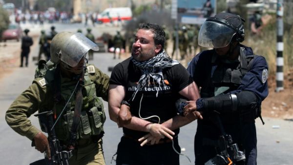 Israeli army detains Palestinian during clashes. (AFP/ File Photo)