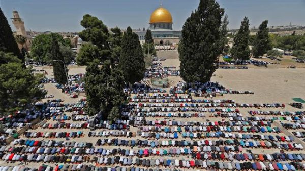 Palestinian worshipers pray near the Dome of the Rock mosque in Al-Aqsa Mosque compound in Jerusalem al-Quds. (AFP/ File)