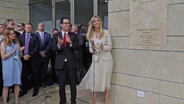 US Treasury Secretary Steve Mnuchin (L) and US President's daughter Ivanka Trump stand next to an inauguration plaque during the opening of the US embassy in Jerusalem on May 14, 2018/AFP