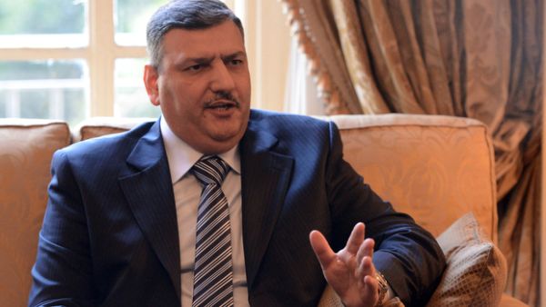 Riyad Hajab, the Syrian opposition coordinator, speaking at a meeting in Cairo in 2013. (AFP/File)
