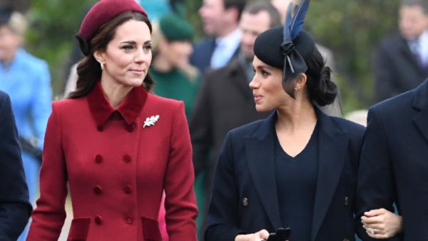 Britain's Catherine, Duchess of Cambridge (L) talks to Meghan, Duchess of Sussex as they arrive for the Royal Family's traditional Christmas Day service at St Mary Magdalene Church. (AFP/File)