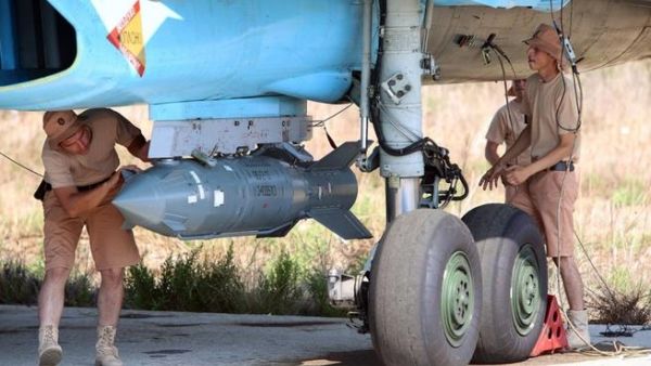 Russian technicians check a bomber at an airbase in Syria. (AFP/Alexander Kots)