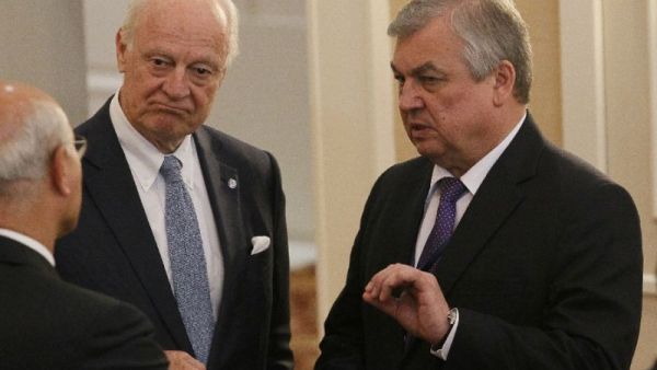 Russian mediator Alexander Lavrentiev (R) reportedly held extensive discussions on the situation in Syria with Ali Shamkhani, secretary of Iran's Supreme Council on National Security, and other officials (AFP/Stanislav FILIPPOV)