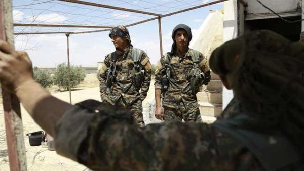 SDF fighters near Manbij, Syria (AFP/Delil Souleiman)