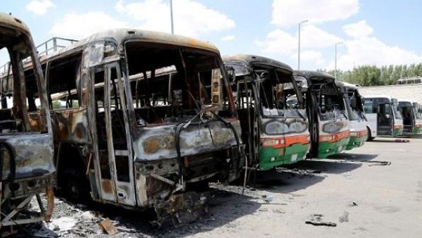 Buses allegedly torched by disgruntled Binladin construction workers. (Telesurtv.net)