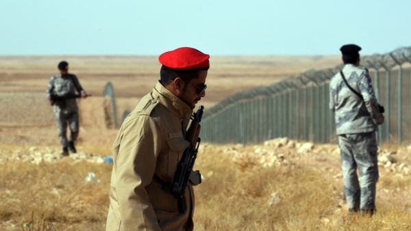 Members of the Saudi border guards patrol the fence on the Iraqi border. (AFP/ File Photo)