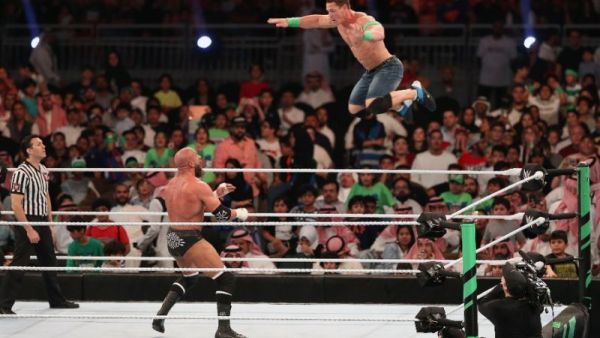 John Cena (R) competes with Triple H during the World Wrestling Entertainment (WWE) Greatest Royal Rumble event in the Saudi coastal city of Jeddah (AFP Photo/STRINGER)
