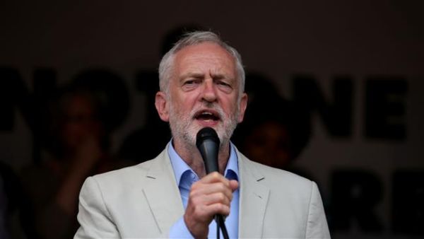 UK opposition Labour party leader Jeremy Corbyn speaks to protesters in Parliament square during an anti-austerity demonstration on July 1, 2017 in London. (Photo by AFP)