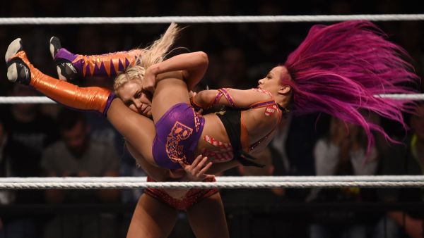 WWE wrestling stars Sasha Bank (R) and Charlotte Flair (L) fight during a WWE women's fight.. (AFP/ File Photo)