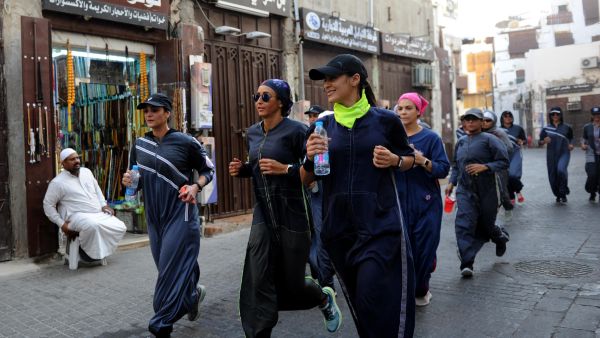 Saudi women jog in the streets of Jeddah in March. The government is encouraging greater participation of women in sports. (AFP/ File Photo)