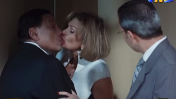 Yousra Kisses Adel Imam in their film "Boboos." (YouTube)