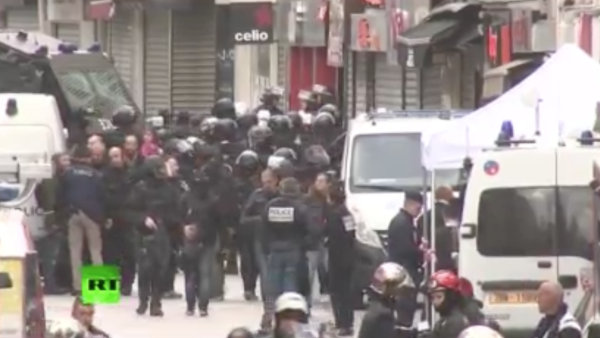A live feed shows the police raid on a Saint Denis flat that's been underway since early Wednesday morning. 