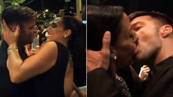 At your service: Female fan pays $90,000 to kiss Ricky Martin on the lips at AIDS charity fundraiser. (YouTube)