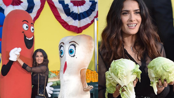 Salma dances with a 'sausage' at the premiere of Sausage Party. (Instagram)