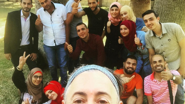 Alan with a group of Syrian refugees in Lebanon. (Instagram)