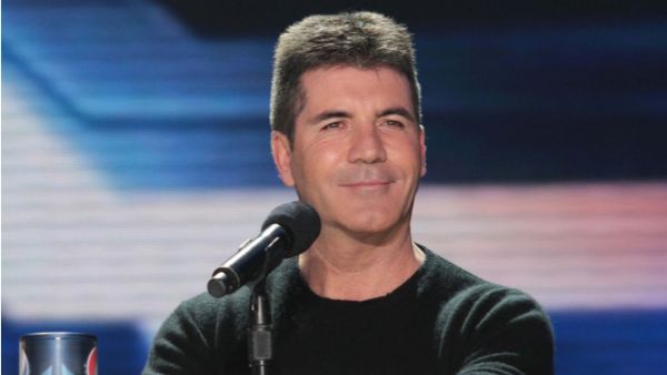 Simon Cowell hopes his young son Eric will be in a boyband when he's older. (Source: s_bukley / Shutterstock)