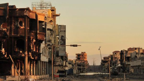 Sirte, Libya has faced extensive bombings and fighting, pushing families outside of the city. (AFP/File)