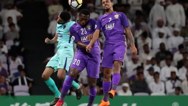 Al-Ain's forward Ahmed Khalil (C) and midfielder Caio (R) vie for the header with Al-Hilal's defender Mohammed Al-Breik during the AFC Champions League football match between UAE's al-Ain and Saudi's al-Hilal at the Hazza bin Zayed Stadium in Al-Ain, on April 2, 2018.
KARIM SAHIB / AFP