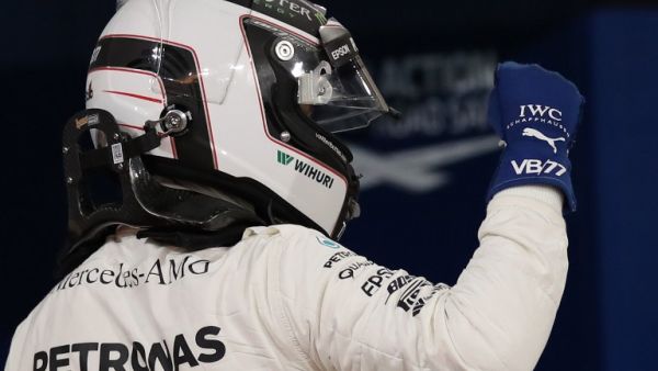 Mercedes' Finnish driver Valtteri Bottas celebrates after taking the pole position at the end of the qualifying for the Bahrain Formula One Grand Prix at the Sakhir circuit in Manama on April 15, 2017.
Karim Sahib / AFP