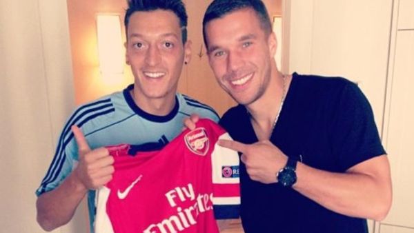 Arsenal's Lukas Podolski hits back at Mesut Ozil critics