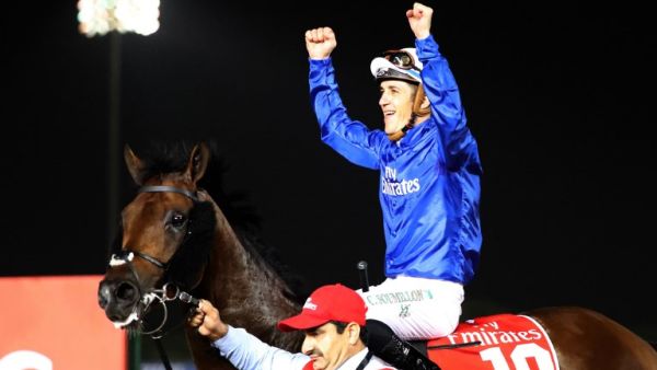 Jockey Christophe Soumillon gestures as he rides Thunder Snow after winning the Dubai World Cup horse race at the Dubai World Cup in the Meydan Racecourse on March 31, 2018 in Dubai. 
KARIM SAHIB / AFP