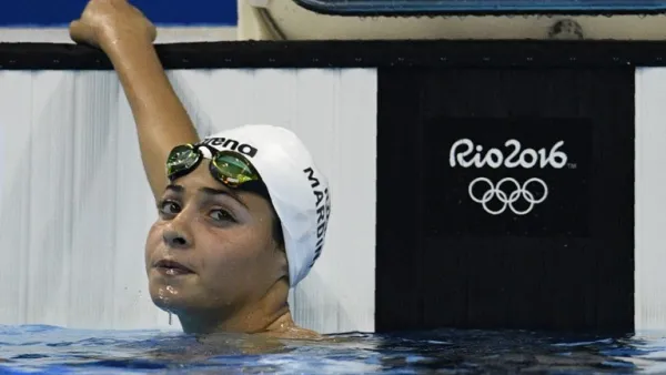 Refugee Olympic Team's Yusra Mardini takes part in the Women's 100m Butterfly heat during the swimming event at the Rio 2016 Olympic Games at the Olympic Aquatics Stadium in Rio de Janeiro on August 6, 2016.
Martin BUREAU / AFP