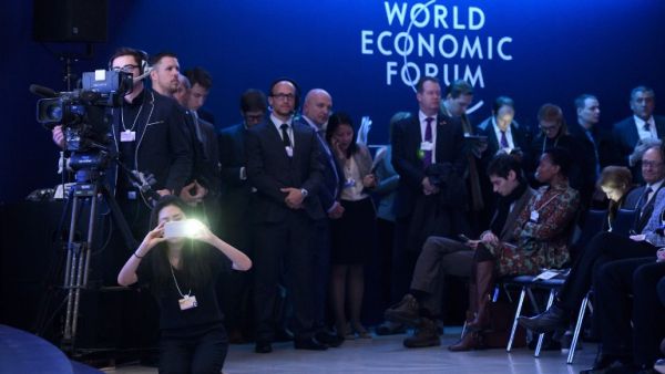 Members of the press at Davos 2017. (AFP/Fabrice Coffrini)