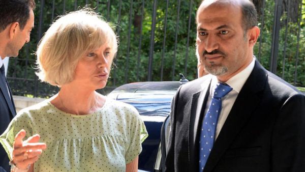 FRANCE, Paris : Syria's new opposition chief Ahmad Jarba is welcomed by Elisabeth Guigou, head of the French national assembly Foreign Affairs commitee, before his hearing on July 23, 2013 on the fisrt of a two-day visit aimed at convincing France to boost its support for rebels battling Syrian President. AFP PHOTO / PHOTO PIERRE ANDRIEU