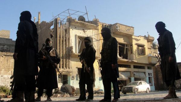 A picture released by opposition-run Shaam News Network on July 2, 2013 shows rebel fighters scouting the area in Syria's central city of Homs. (Source:  "AFP PHOTO / HO / SHAAM NEWS NETWORK")