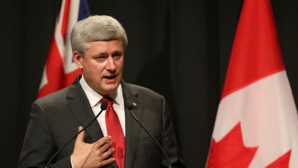 Canada's PM Stephen Harper made an unexpected visit to Iraq, where he met with his Iraqi counterpart Haider al-Abadi Saturday.  (AFP/David Rowland)