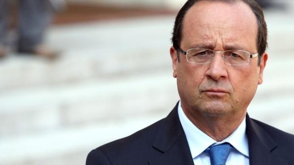 FRANCE, Paris : France's President Francois Hollande speaks during a press conference after a meeting with the President of the National Coalition for Syrian Revolutionary and Opposition Forces (SNC) at the Elysee presidential palace on August 29, 2013 in Paris. AFP PHOTO / KENZO TRIBOUILLARD