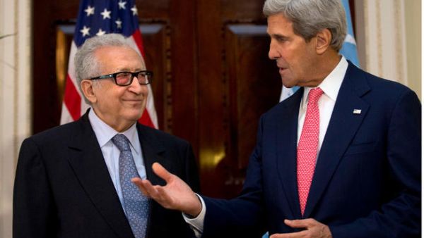 U.N-Arab League envoy for Syria Lakhdar Brahimi (L) listens as U.S. Secretary of State John Kerry speaks. (Image credit: AFP)