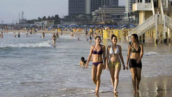 Israeli women enjoy the beach in Tel Aviv.  (AFP/Jonathan Nackstrand)
