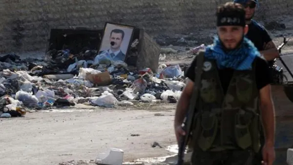 مقاتلون في احد احياء حلب/أ.ف.ب
