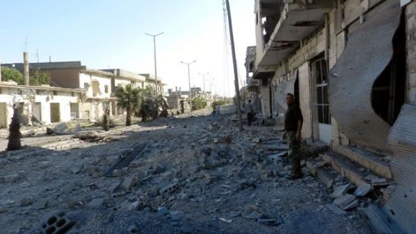 اثار التدمير في الحولة/أ.ف.ب