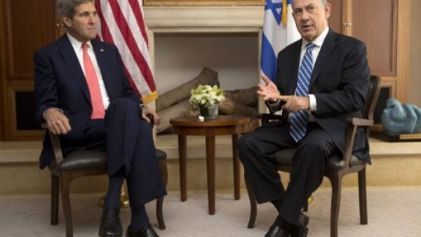 Israeli Prime Minister Benjamin Netanyahu speaks near US Secretary of State John Kerry during a meeting on November 6, 2013 in Jerusalem.