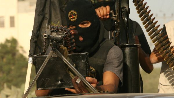 Masked fighters from the Palestinian Islamic Jihad's military wing 'Saraya Al-Quds' or 'Jerusalem Brigades' take part in a military parade in the streets of the southern Gaza Strip town of Rafah on October 28, 2010 [Getty Images]
