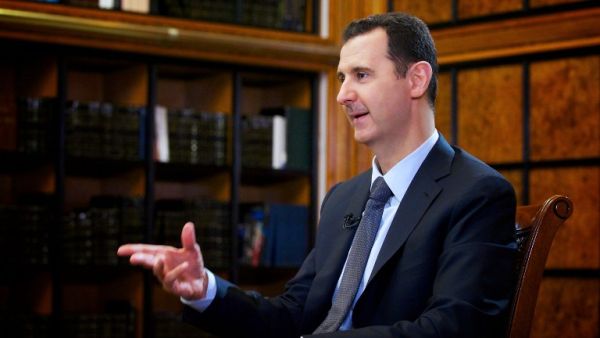 SYRIA, DAMASCUS : A handout picture released by the official Syrian Arab News Agency (SANA) on September 12, 2013, shows President Bashar al-Assad attending an interview with Russian television [AFP]
