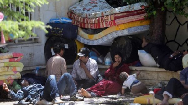 عائلة سورية لاجئة في بلدة عرسال اللبنانية/أ.ف.ب