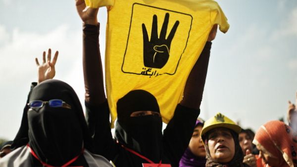 A female supporter of the Muslim Brotherhood and of ousted president Mohamed Morsi during a rally outside the Police Academy where his trial is taking place on November 4, 2013, in Cairo. [GIANLUIGI GUERCIA/AFP/Getty Images]