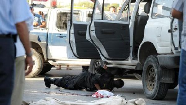 Tunisian police inspect the site of an exchange of fire between police forces and members of a Salafist group on October 25, 2013. [AFP]

