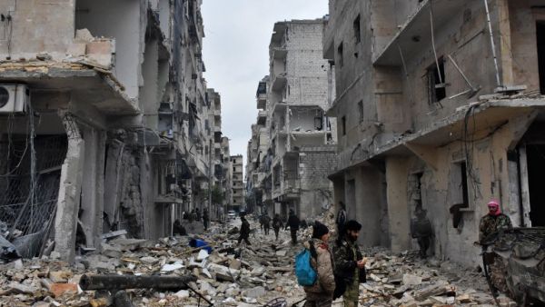 Pro-government forces advance in Jisr al-Haj district of Aleppo (George Ourfalian/AFP)